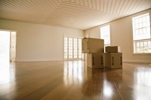 Four boxes in an empty room.