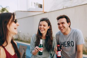 friends drinking beer and laughing