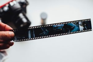 person holding a film roll