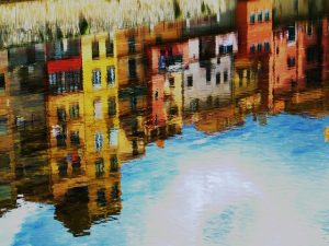 Painting of the reflection of buildings in the water