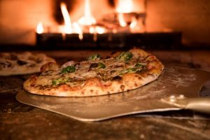 A pizza in an oven you can enjoy after moving to Highland Beach