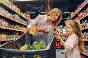 mom and daughter shopping for groceries