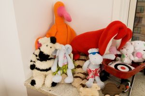 Stuffed animals on a bed