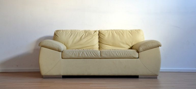 a sofa in an empty room 