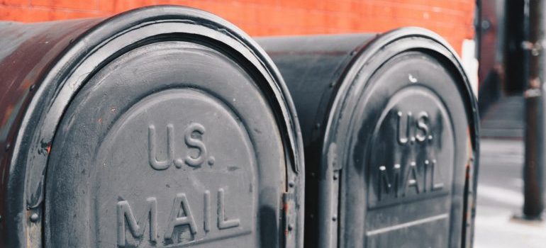 two gray mailboxes