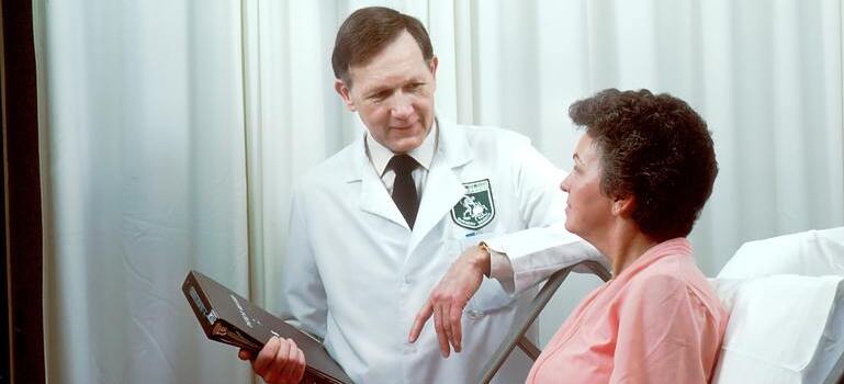 a doctor talking to a woman