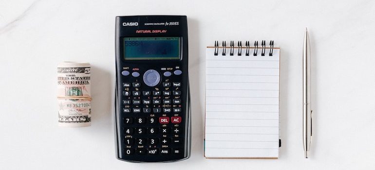 money calculator notepad and pen