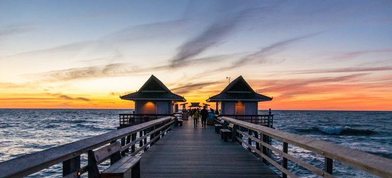 Florida pier at sunset - a place you can be while your South Point movers work.