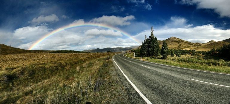 A rainbow at the end of a road 