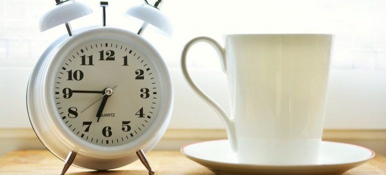 Alarm clock and cup