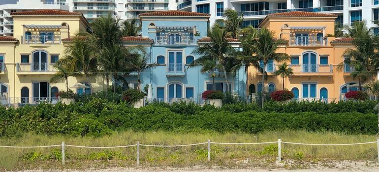 three houses next to the beach