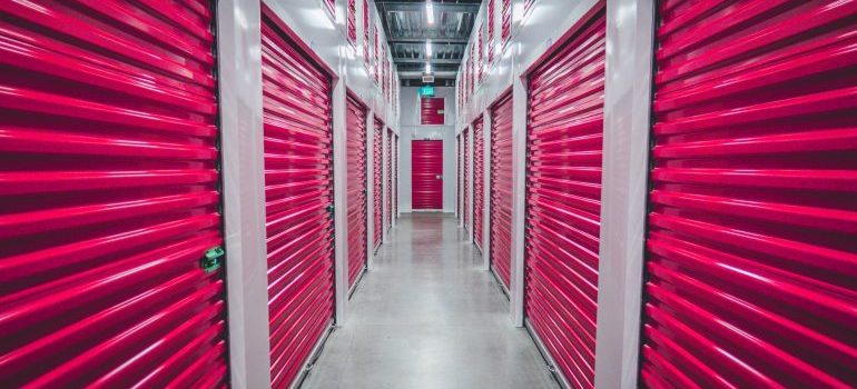 Storage units with pink doors.
