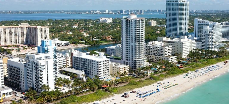 Ocean waters, white sand beach and condo buildings are the reason to buy a vacation home in Sunny Isles Beach. 