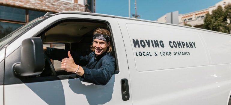 The moving company guy thumbs up