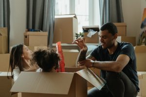 a family playing in moving boxes
