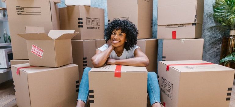 a woman among moving boxes