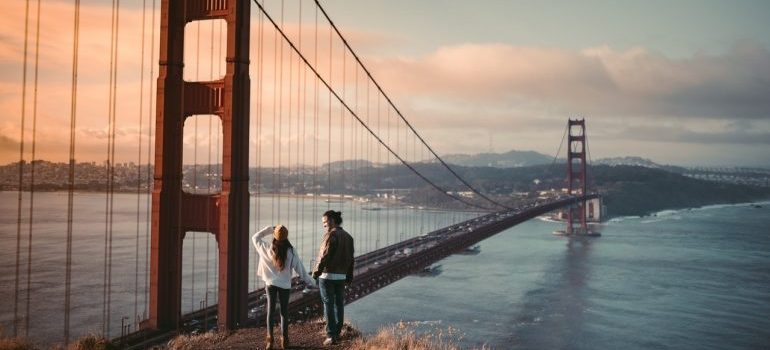 Couple standing in front of the Golden Gate