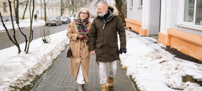 Elderly couple walking during winter