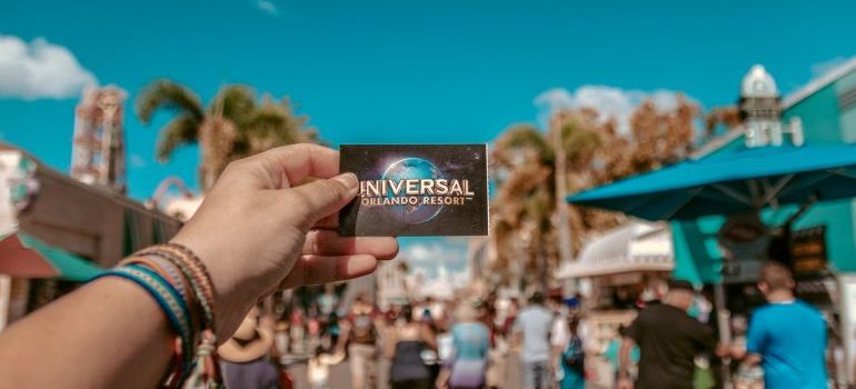 Person holding universal card in one of the best places to live in Florida for families