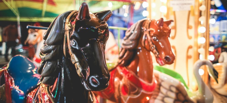 a horse on the carousel as one of the best family fun ideas in Palm Beach Gardens