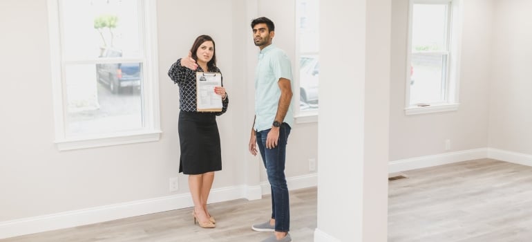a real estate agent showing a potential buyer a home