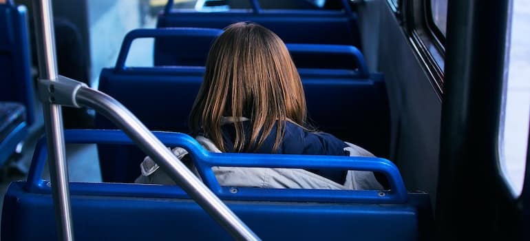 A girl sitting on the bus