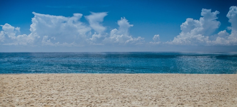 white beach and blue ocean