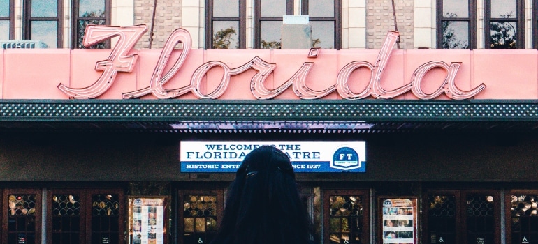 woman standing in front of the sign that says Florida
